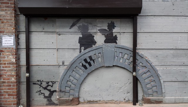 Our Recent Local Banksy Piece Gets the Plexiglass and Gate Treatment